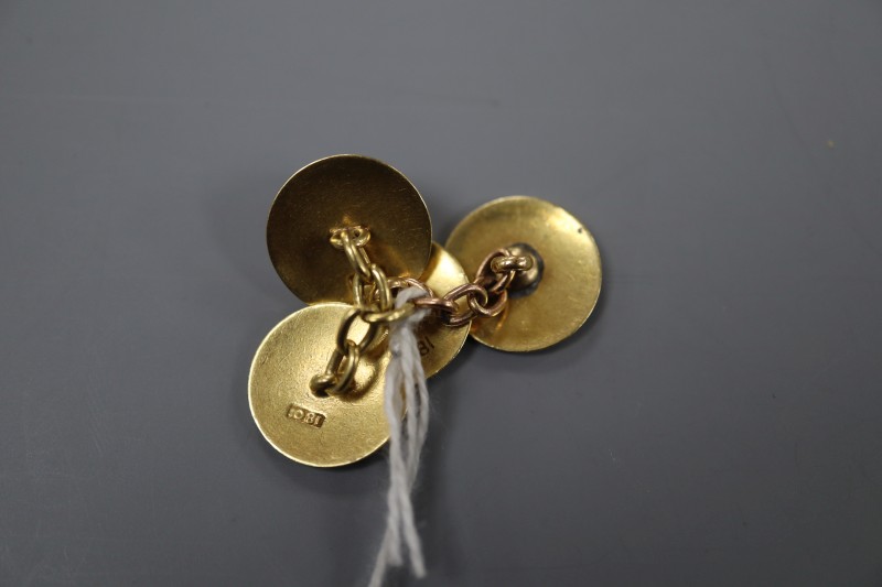 A pair of 18ct and enamel disc cufflinks, diameter 14mm, gross 8.3 grams.